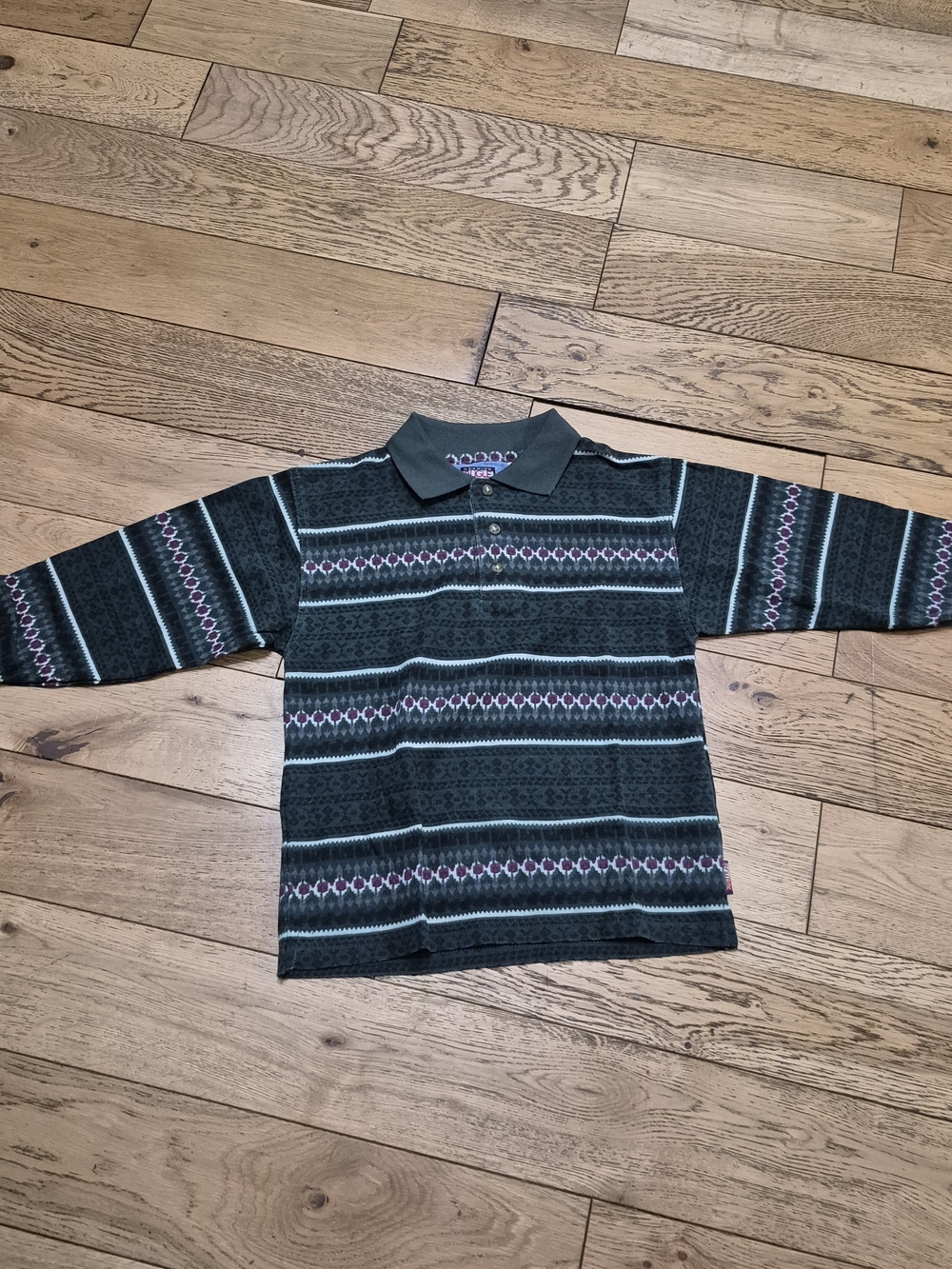 Vintage Bugle Boy long-sleeve polo shirt in Boys size Large. Features an all-ov